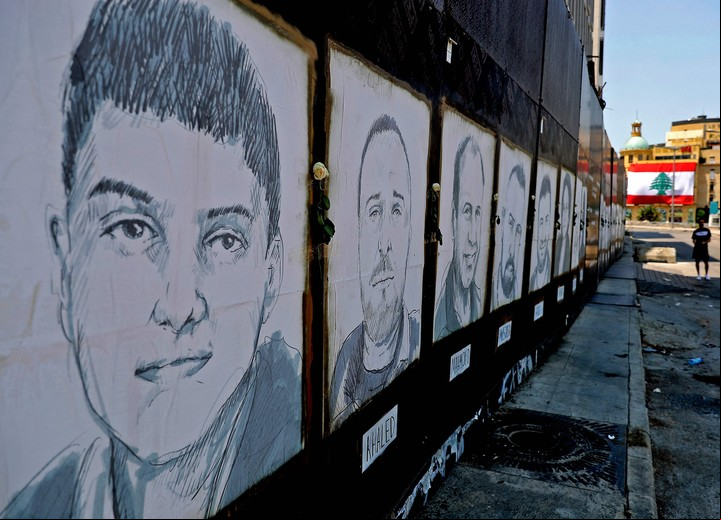 Retratos de las víctimas, a un año de la explosión. Foto: AFP