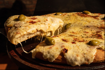 Dónde comer pizza porteña al molde con la mejor técnica profesional
